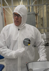 Peter Duda, Technical Director of the University of Chicago’s Pritzker Nanofabrication Facility, holds a pure, four-inch silicon wafer