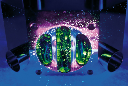 Visualisation of the fluorescent effect of riboflavin under UV light on a valve interface component in a test rig