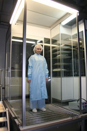 Figure 2: Test subject in walking simulation with cleanroom coat and suitable equipment 